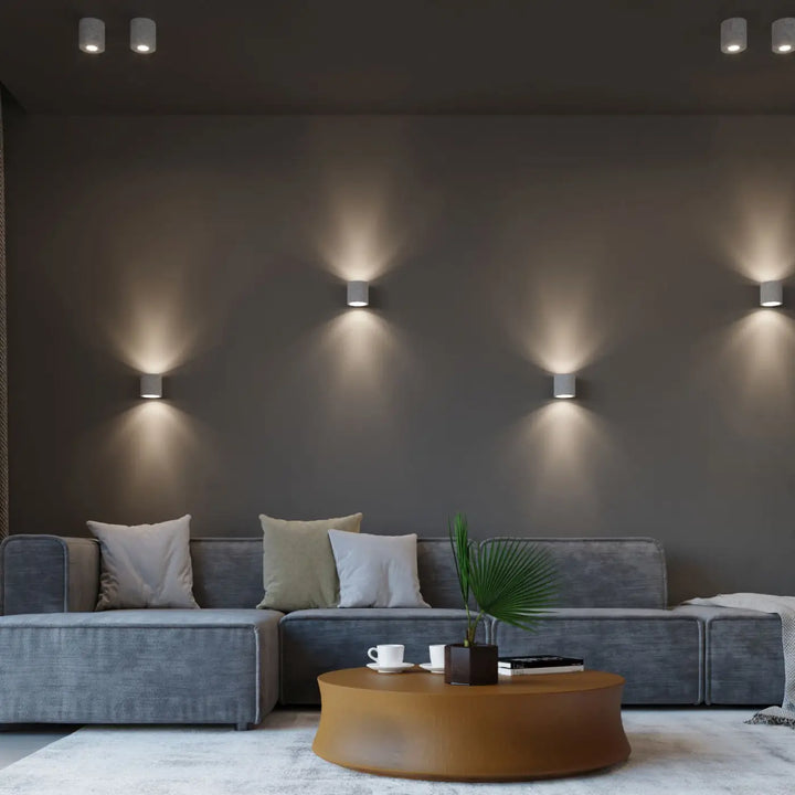 Kinkiet orbis beton moderne avec corps cylindrique blanc et éclairage chaleureux et ciblé pour mur minimaliste