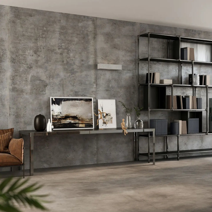 Black metal bookshelf à étagères ouvertes design minimaliste associé à l’applique murale vega béton moderne pour une atmosphère harmonieuse