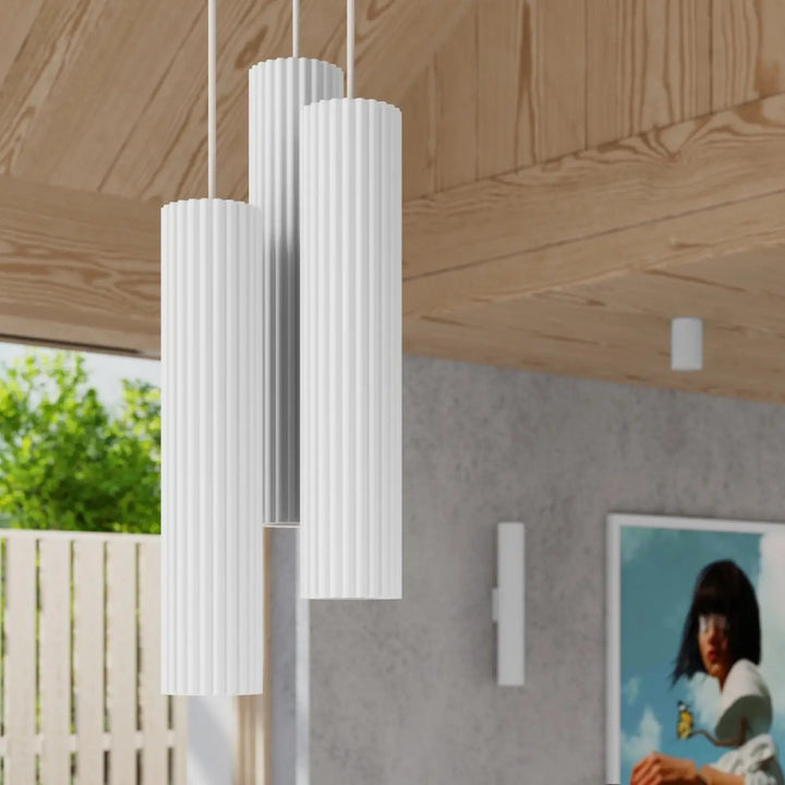 Trois plafonniers karbon allie blancs cylindriques à rainures verticales avec ampoules gu10 interchangeables design minimaliste