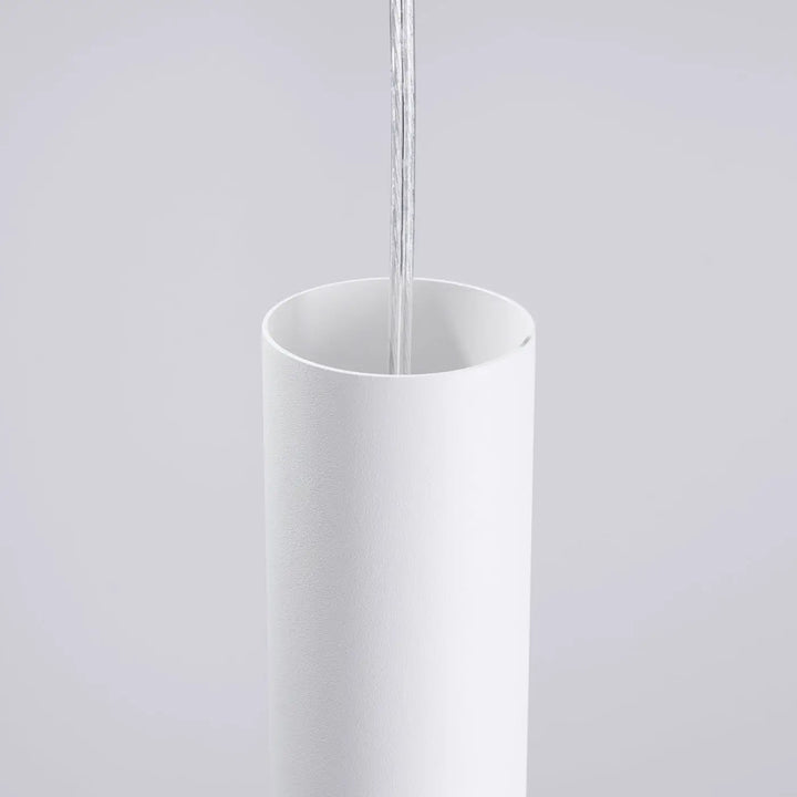 Applique murale lami blanc avec finition originale en cylindre minimaliste offrant un effet visuel unique et découpes décoratives
