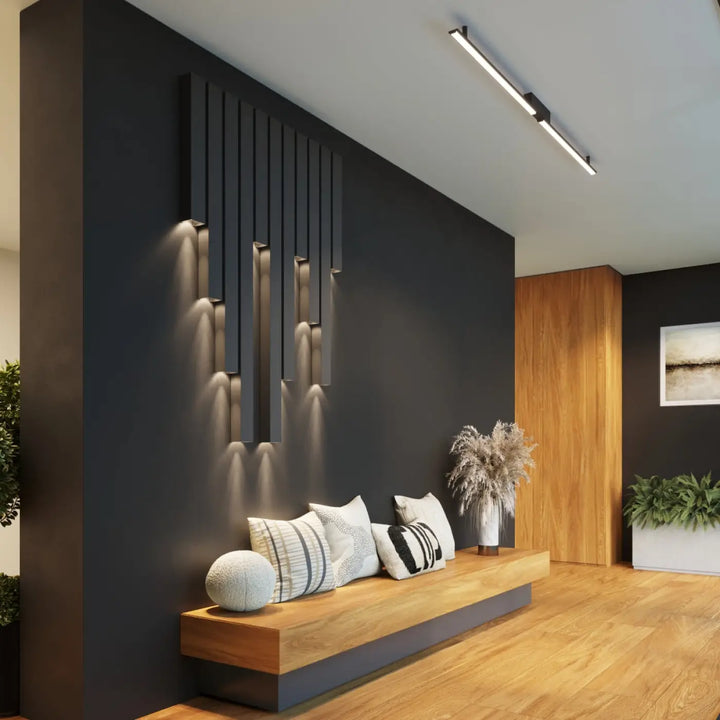 Applique murale noire moderne avec bandes led intégrées de la collection freya en cinq coloris montée sur mur sombre