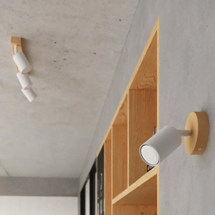 Applique murale verdo design moderne avec tête cylindrique blanche mate et base circulaire en bois clair