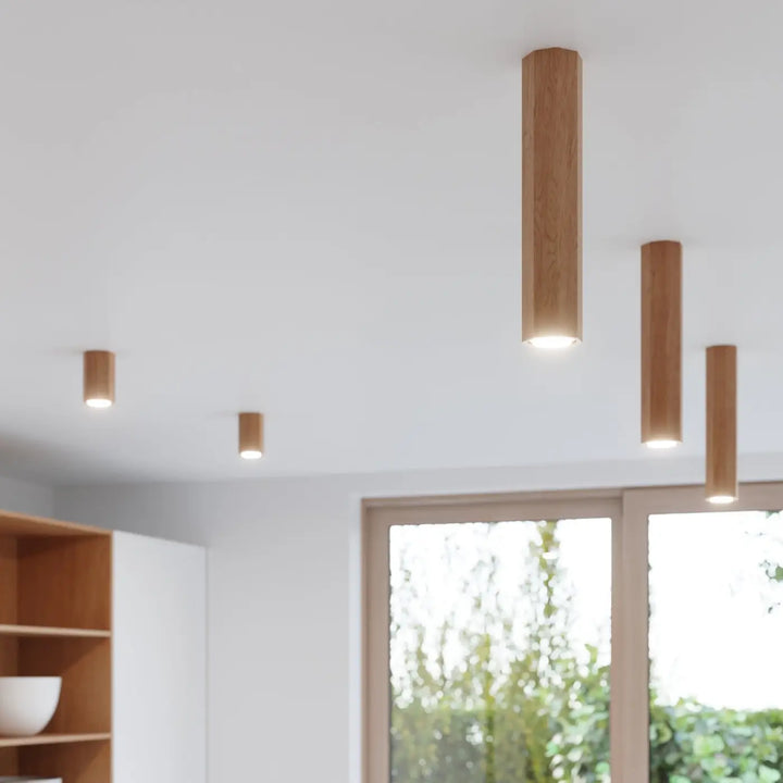 Applique murale lampe zeke en bois naturel finition chêne avec éclairage chaud et doux qui s’intégrera parfaitement