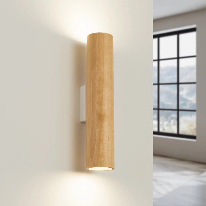 Applique murale lino en bois avec un design cylindrique élégant et une lueur chaude issue de matériaux nobles
