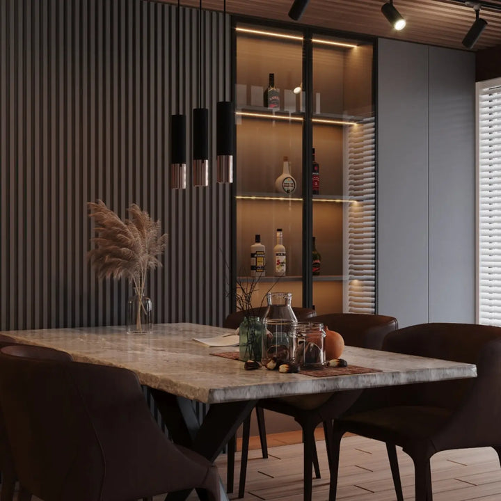 Marble dining table with dark metal legs and a sleek modern design complementing applique murale loopez noir cuivre