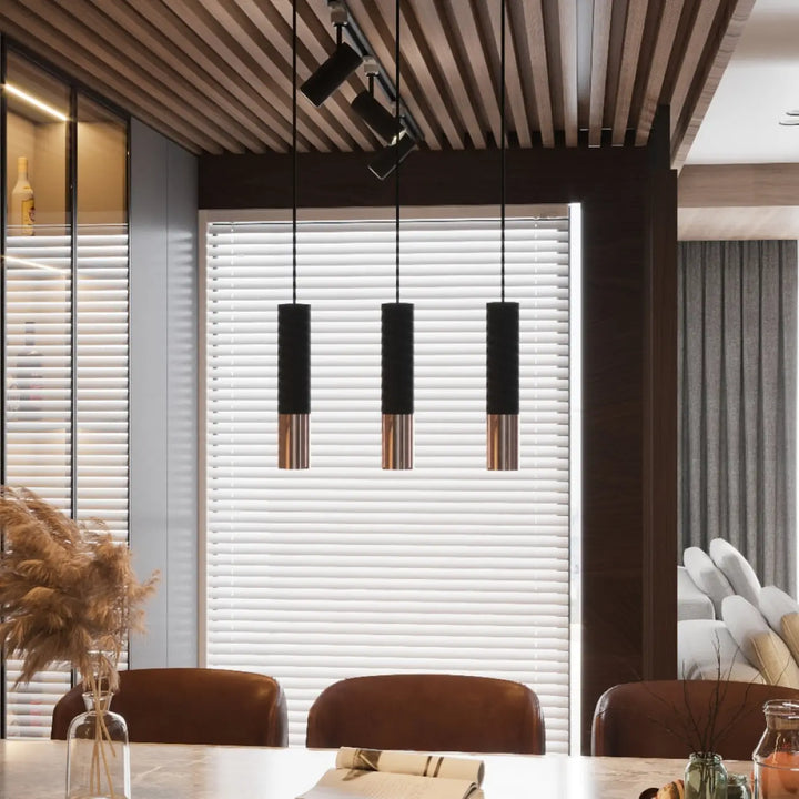 Trois appliques murales loopez modernes cylindriques en noir cuivre suspendues au plafond