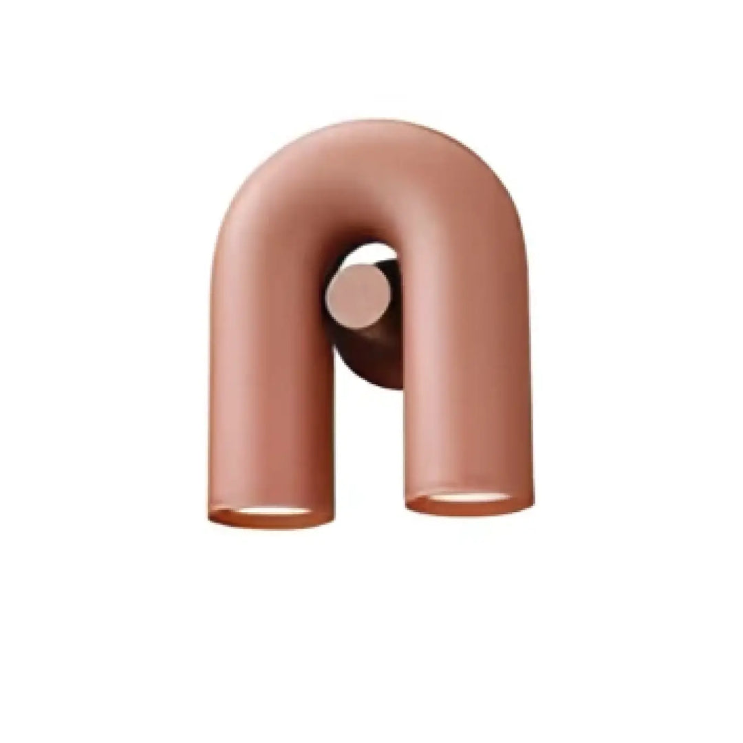 Applique murale kora avec crochet u en métal mat rose gold au design minimaliste et élégant