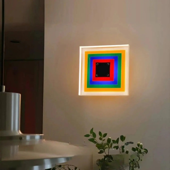 Applique murale vivao murale design carrée avec anneaux led arc-en-ciel concentriques et panneau central noir