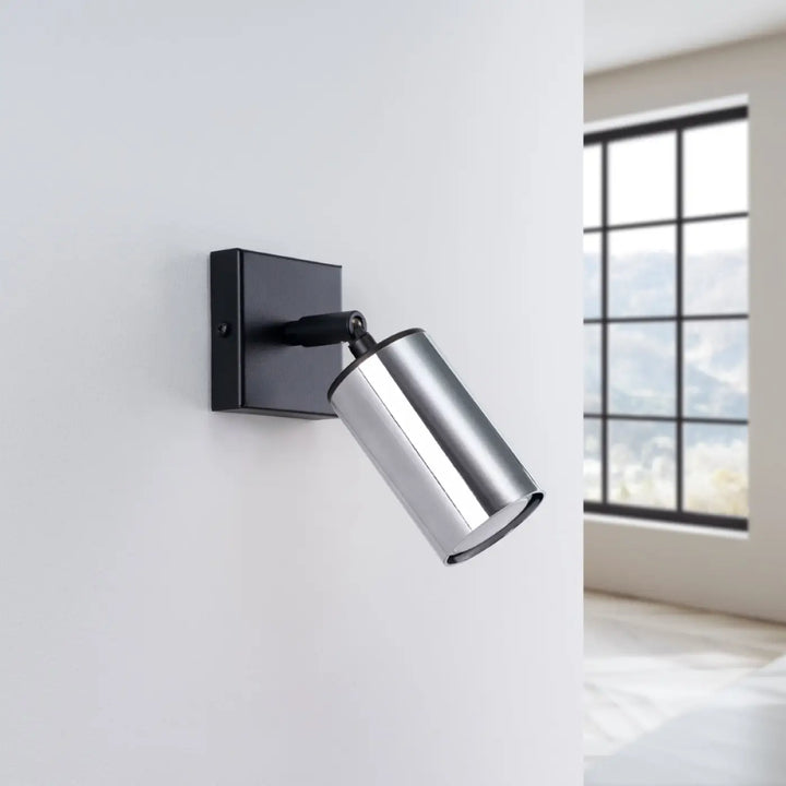 Applique murale winx noir chrome avec spot cylindrique moderne en chrome et noir pour un éclairage design