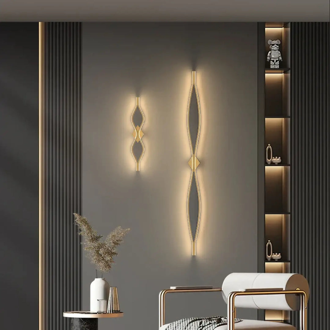 Applique murale alixa en métal doré avec design géométrique moderne diffuse une lumière d’ambiance chaude pour salle à manger ou chambre
