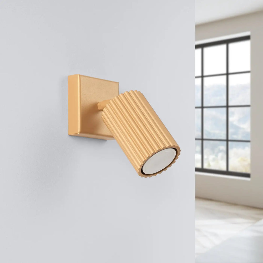 Applique murale karbon dorée avec tête cylindrique rainurée et ampoules gu10 interchangeables design minimaliste