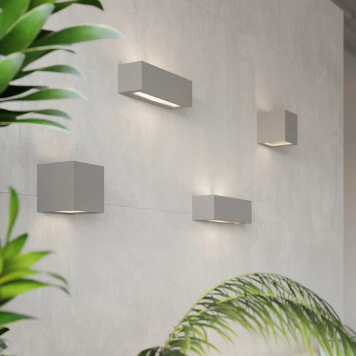 Applique murale moderne en céramique leo gris avec design minimaliste et belle lumière blanche douce