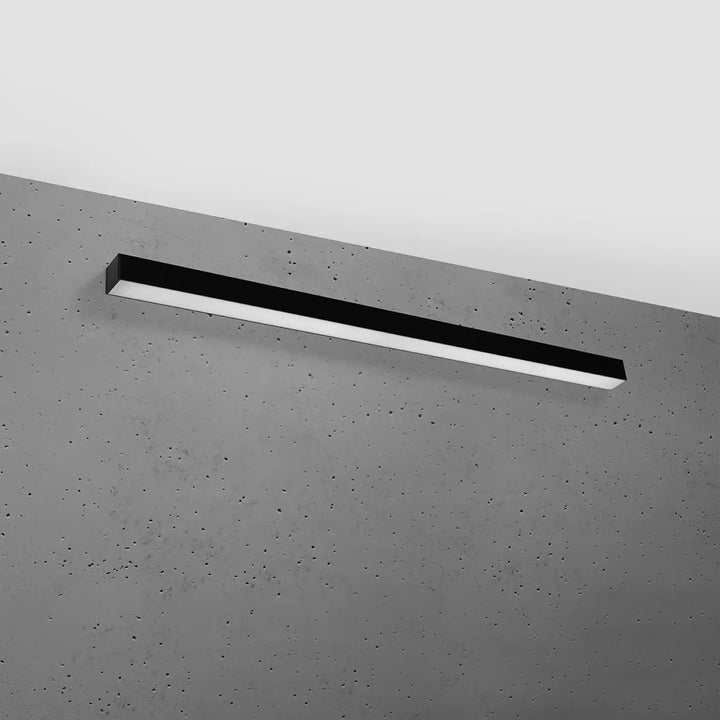 Applique murale pinne 118 noir en led avec design moderne sur mur béton gris réglable paramètres d’éclairage différentes tailles