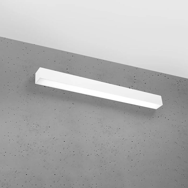 Applique murale pinne 67 3000k blanc rectangulaire en led montée sur mur en béton avec module led et paramètres d’éclairage