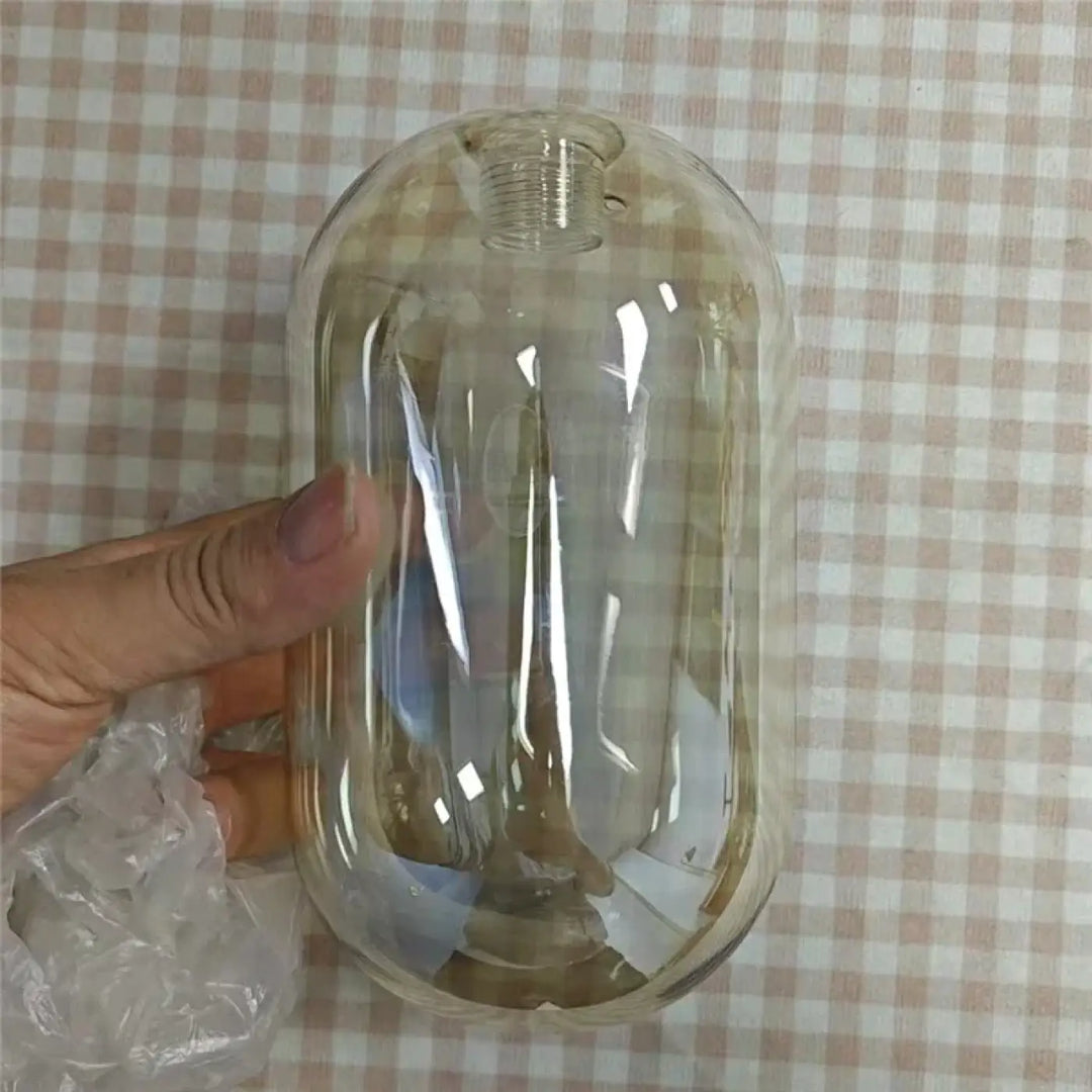 Applique murale minimaliste en verre avec tige en laiton intemporelle