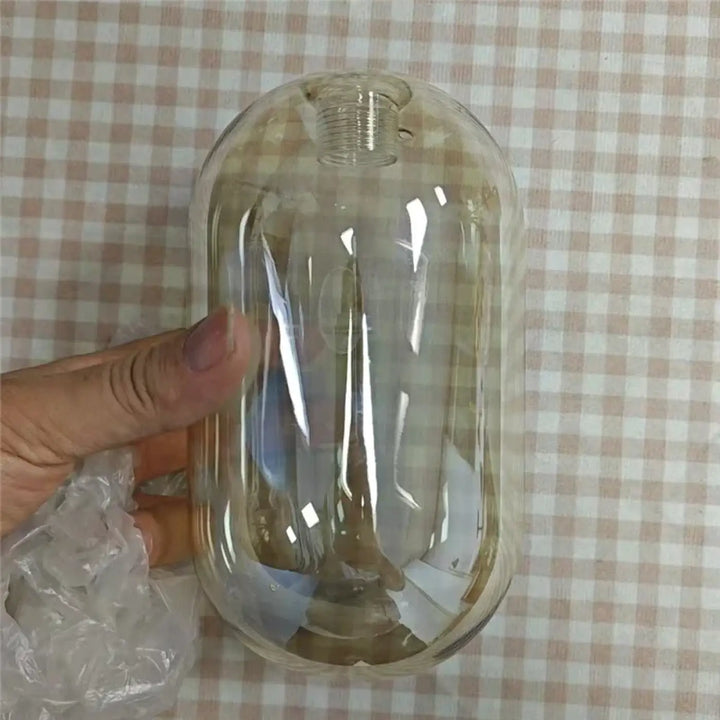 Applique murale minimaliste en verre avec tige en laiton intemporelle