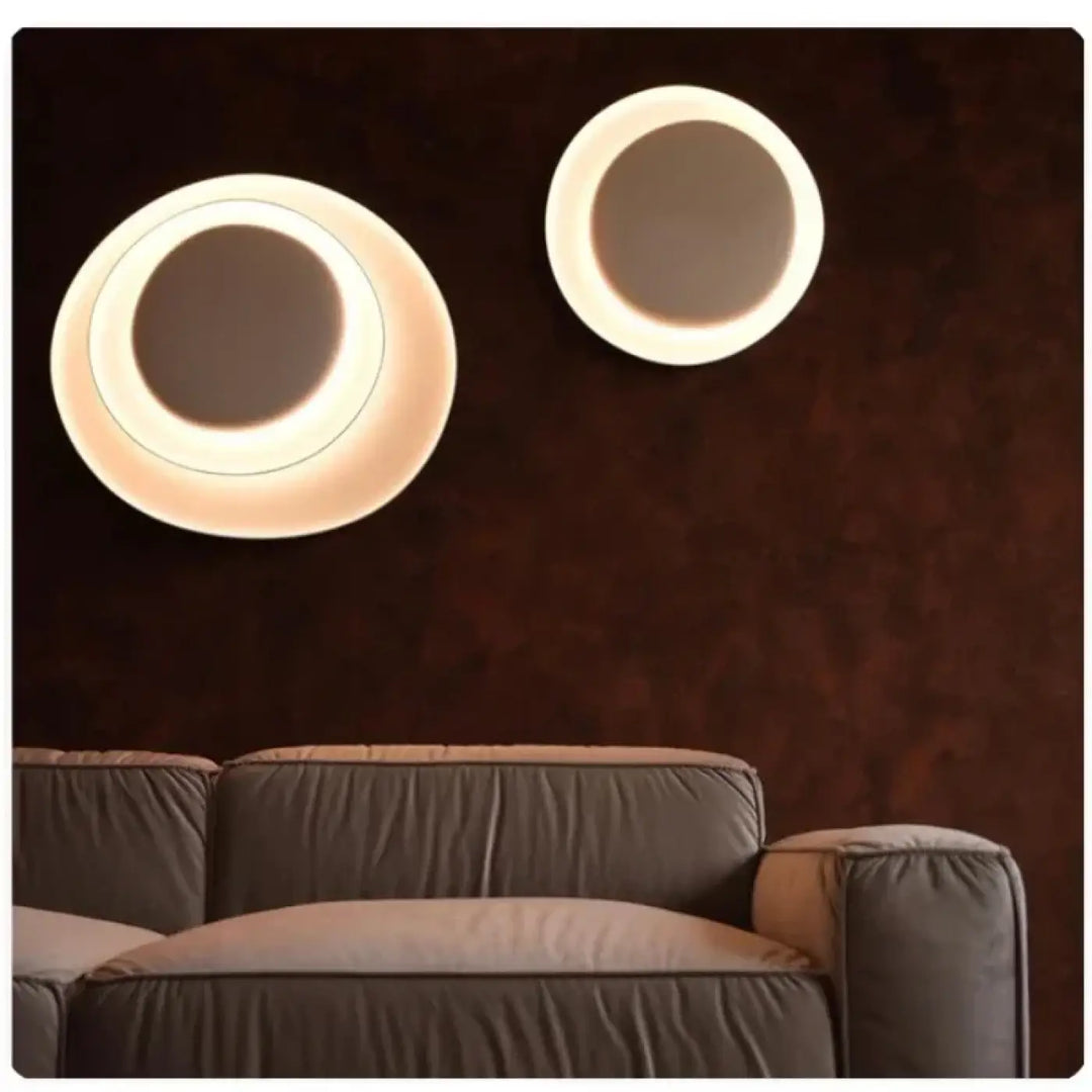 Applique murale novae avec cercles sculptés et anneau led chaud pour une murale moderne élégante et lumineuse