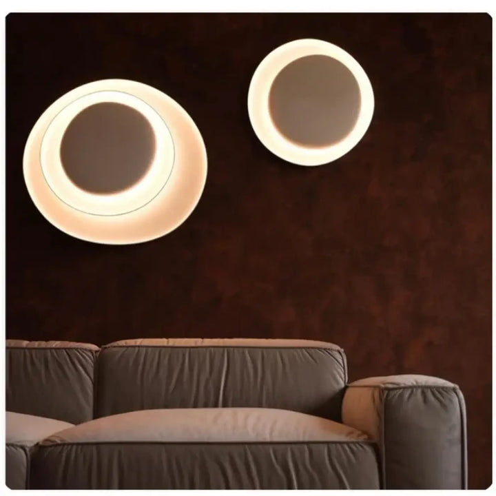 Applique murale novae avec cercles sculptés et anneau led chaud pour une murale moderne élégante et lumineuse
