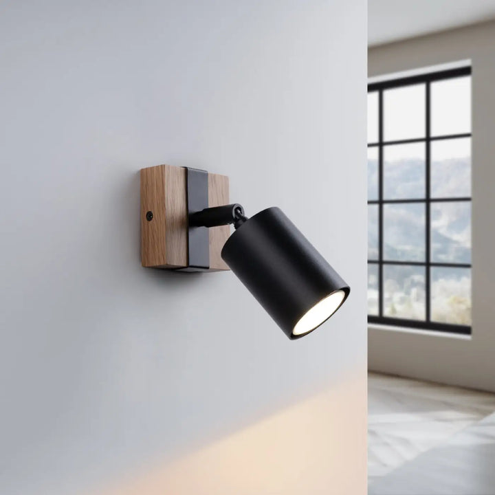 Applique murale lampe directionnelle fager 1 noire avec boîtier moderne en métal mat et support en bois