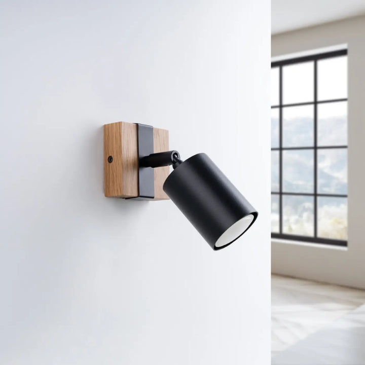 Applique murale fager 1 noir avec lampe directionnelle fager cylindrique et boîtier moderne en bois et noir mat