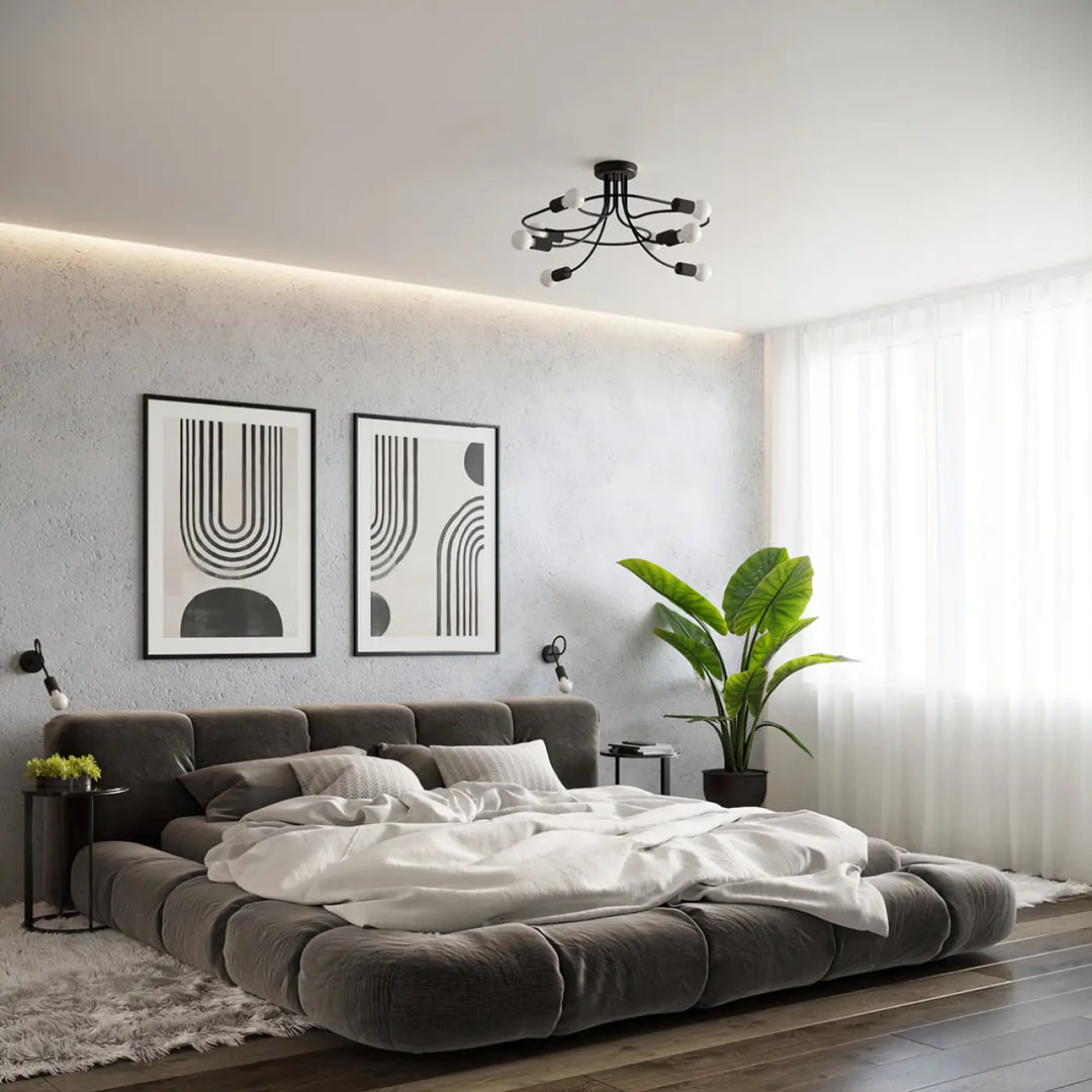 Gray tufted platform bed with white bedding showcasing the incroyablement stylées collection levar noir applique murale