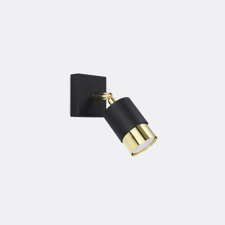 Applique nero noir noire et dorée réglable avec base carrée mate et tête cylindrique en laiton poli de la collection nero