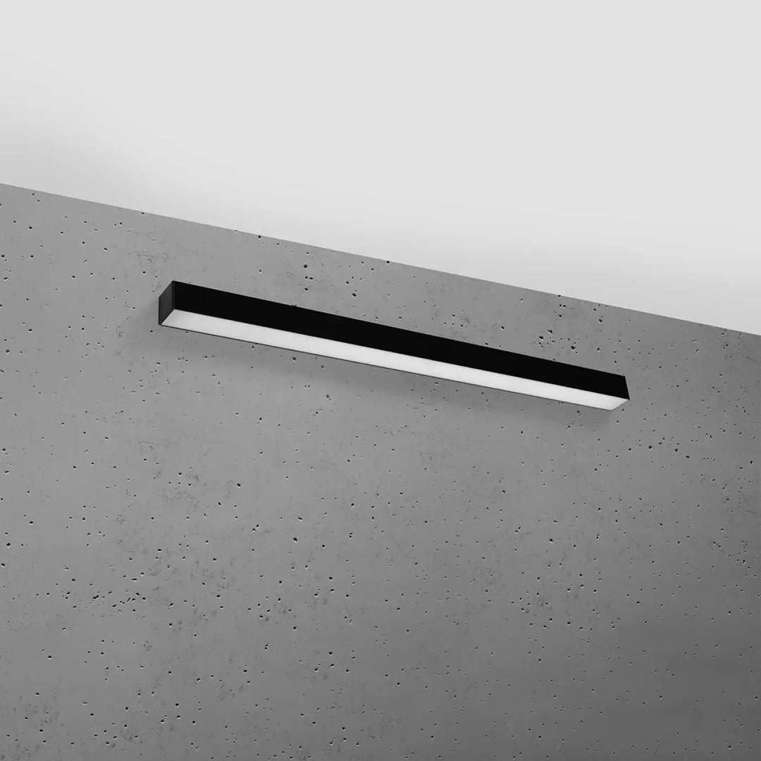 Applique murale pinne 90 4000k noir en led rectangulaire moderne montée sur mur en béton avec paramètres d’éclairage ajustables collection pinne différentes tailles