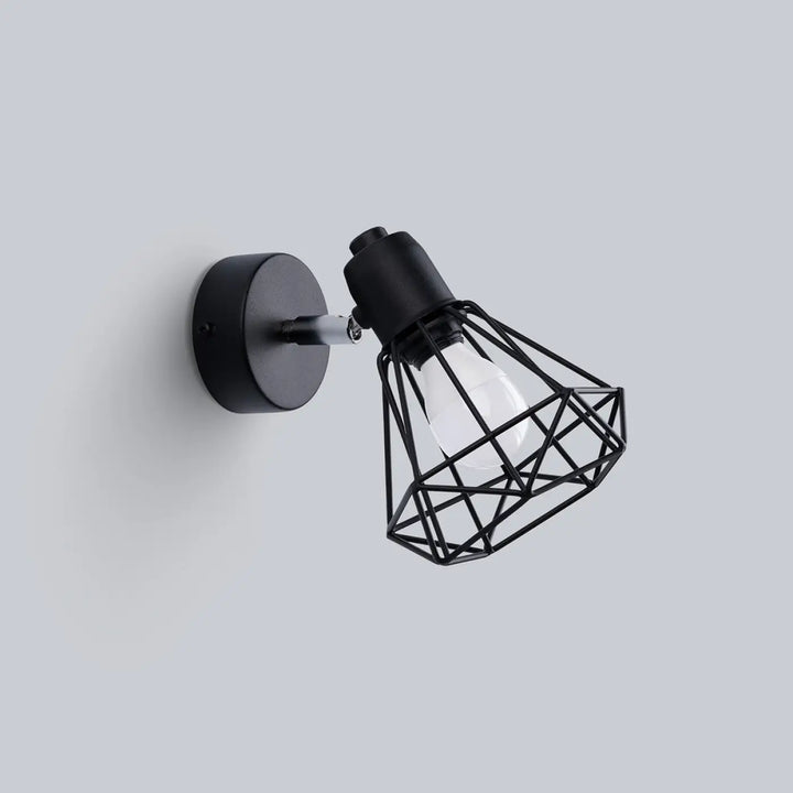 Black metal applique murale série artemis 1 noir avec cage géométrique exposant une ampoule pour atmosphère intime