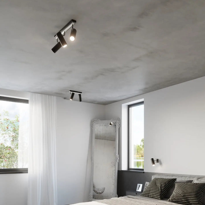 Applique murale minimaliste série direzione en noir avec spots ajustables et éclairage élégant sur plafond texturé