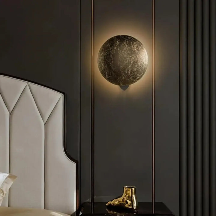 Applique murale ronde LED dorée design effet lune