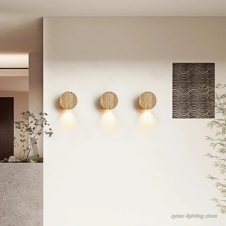 Applique murale ronde LED à l'effet pierre volcanique beige

