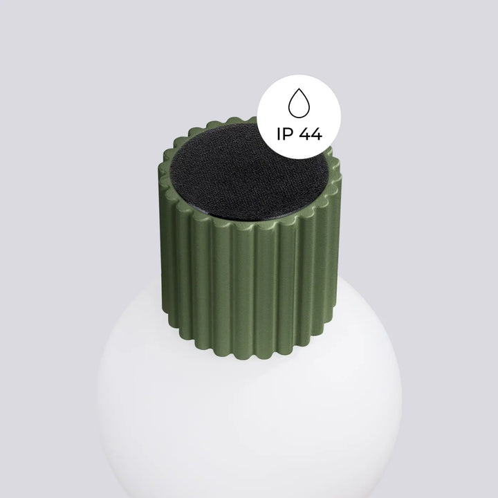 Dos de l applique murale lampe halo vert olive avec capuchon plastique côtelé et tampon adhésif noir texturé