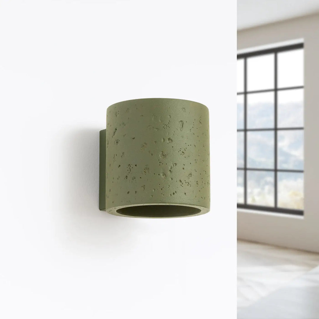 Applique orbis béton vert olive corps géométrique attire avec surface texturée pour un accent décoratif unique