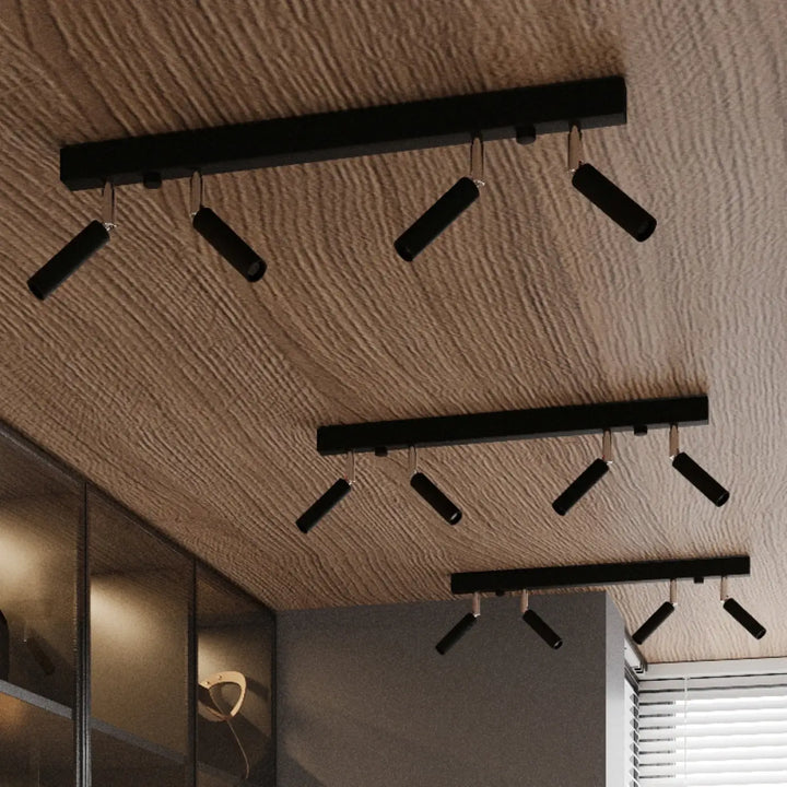 Applique murale moderne style industriel eyetech 1 en noir avec faisceau eyetech et spots réglables sur plafond texturé