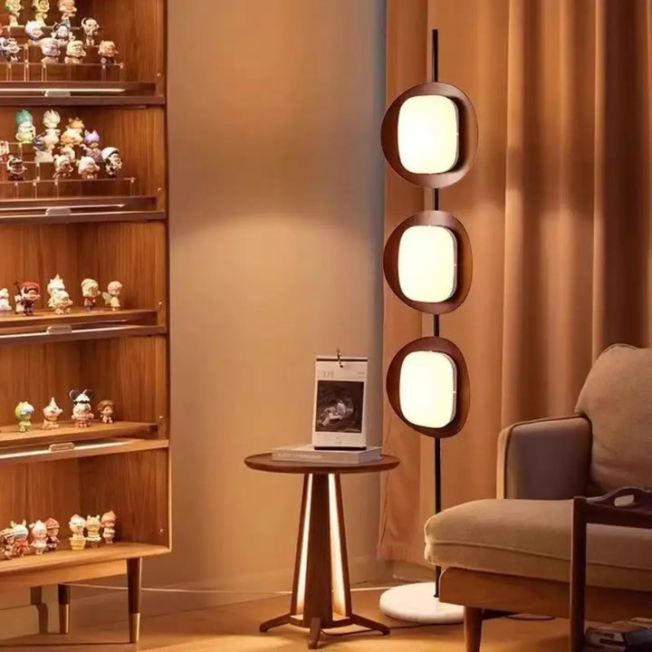 Lampadaire moderne triom avec trois panneaux ovales lumineux blanc chaud en cadres bois foncé fer type