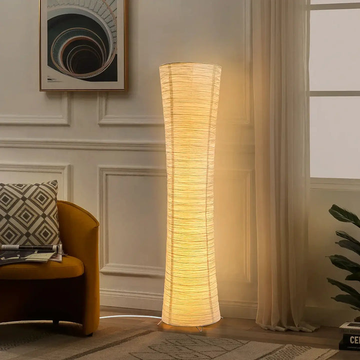 Lampadaire design en papier blanc avec lumière chaleureuse épuré