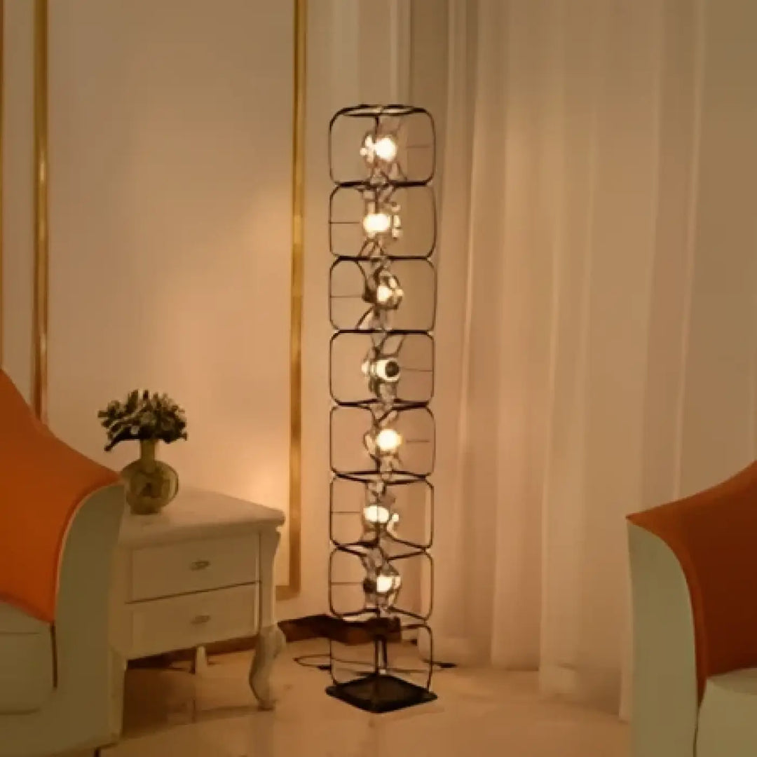 Lampadaire design vertical noir en fer forgé avec plusieurs diffuseurs lumineux esprit artistique luxora