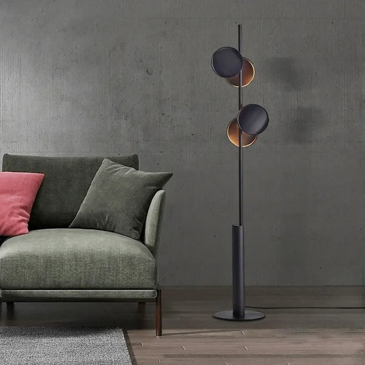 Lampadaire moderne duolia avec double éclairage et silhouette graphique en métal noir mat et cuivre brossé