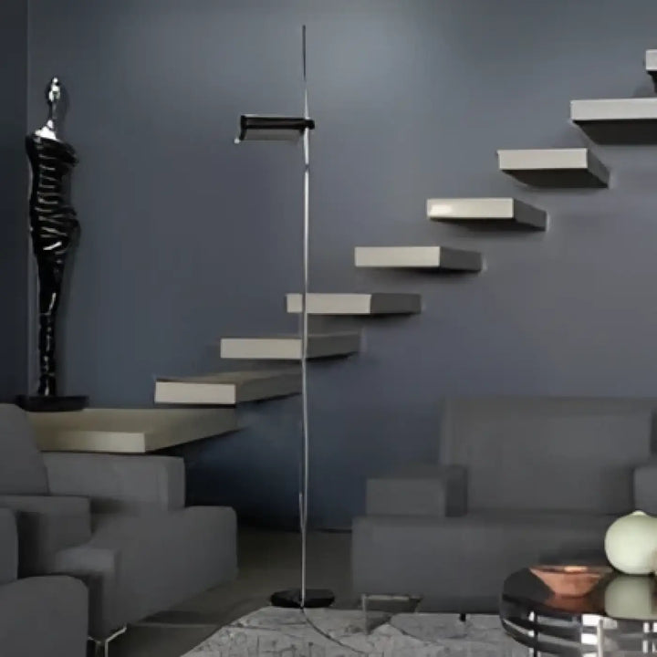 Lampadaire design axys avec tête lumineuse orientable, structure métal noir minimaliste et abat-jour cylindrique élégant