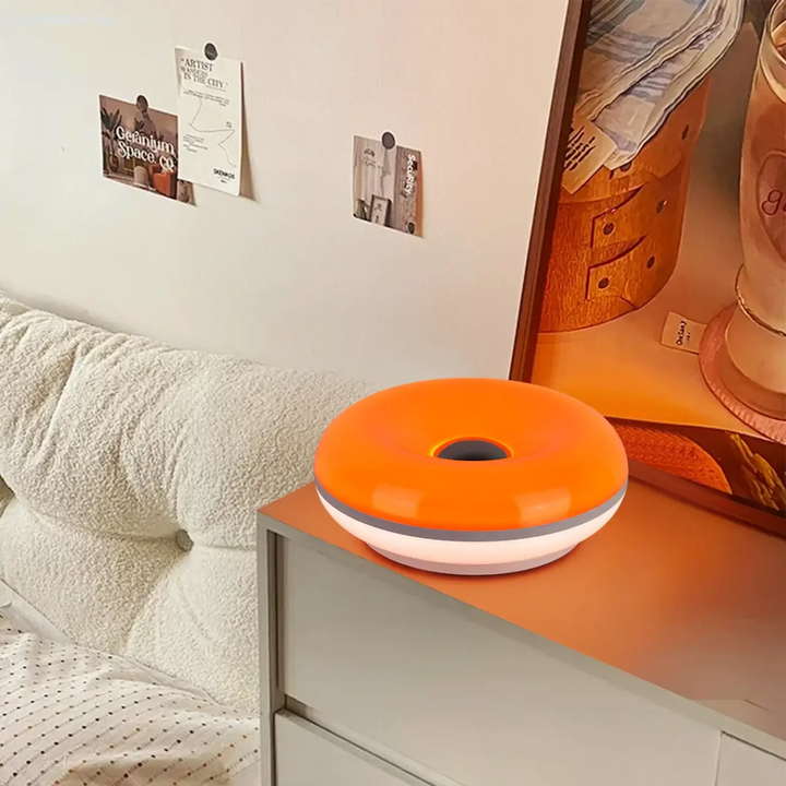 Lampe de table haus ia led orange en forme de donut avec base blanche et anneau gris pour une idée cadeau originale et une touche unique