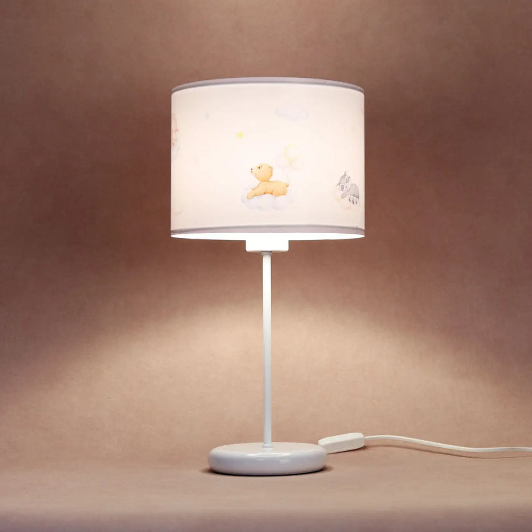 Lampe de table marron clair avec abat-jour cylindrique blanc illustré dourson pleine jaune et éléphant gris
