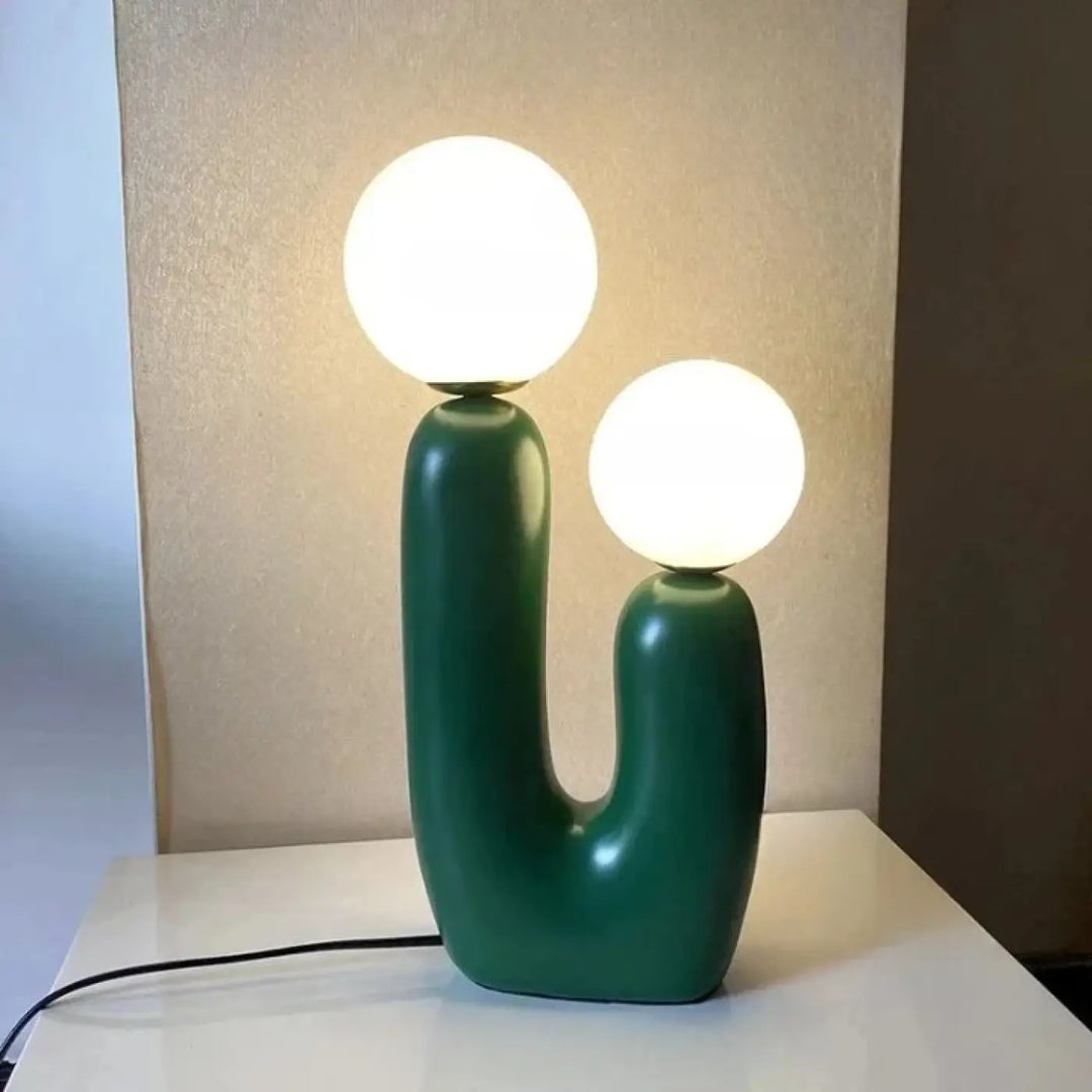 Lampe de table tsilo en céramique vert émeraude avec deux ampoules sphériques blanches lumineuses sont-elles incluses