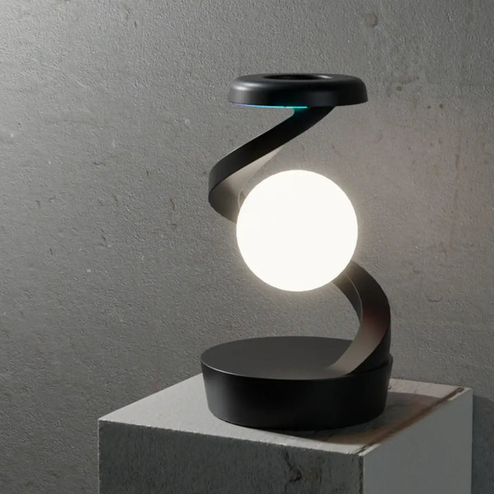 Lampe de table sylora avec design aux formes ondulées noire et ampoule sphérique blanche lumineuse