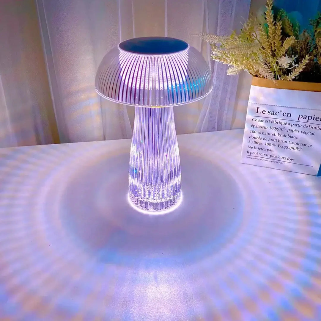 Lampe de table strilia design champignon aux reflets translucide à lumière bleue et blanche émanant de la base
