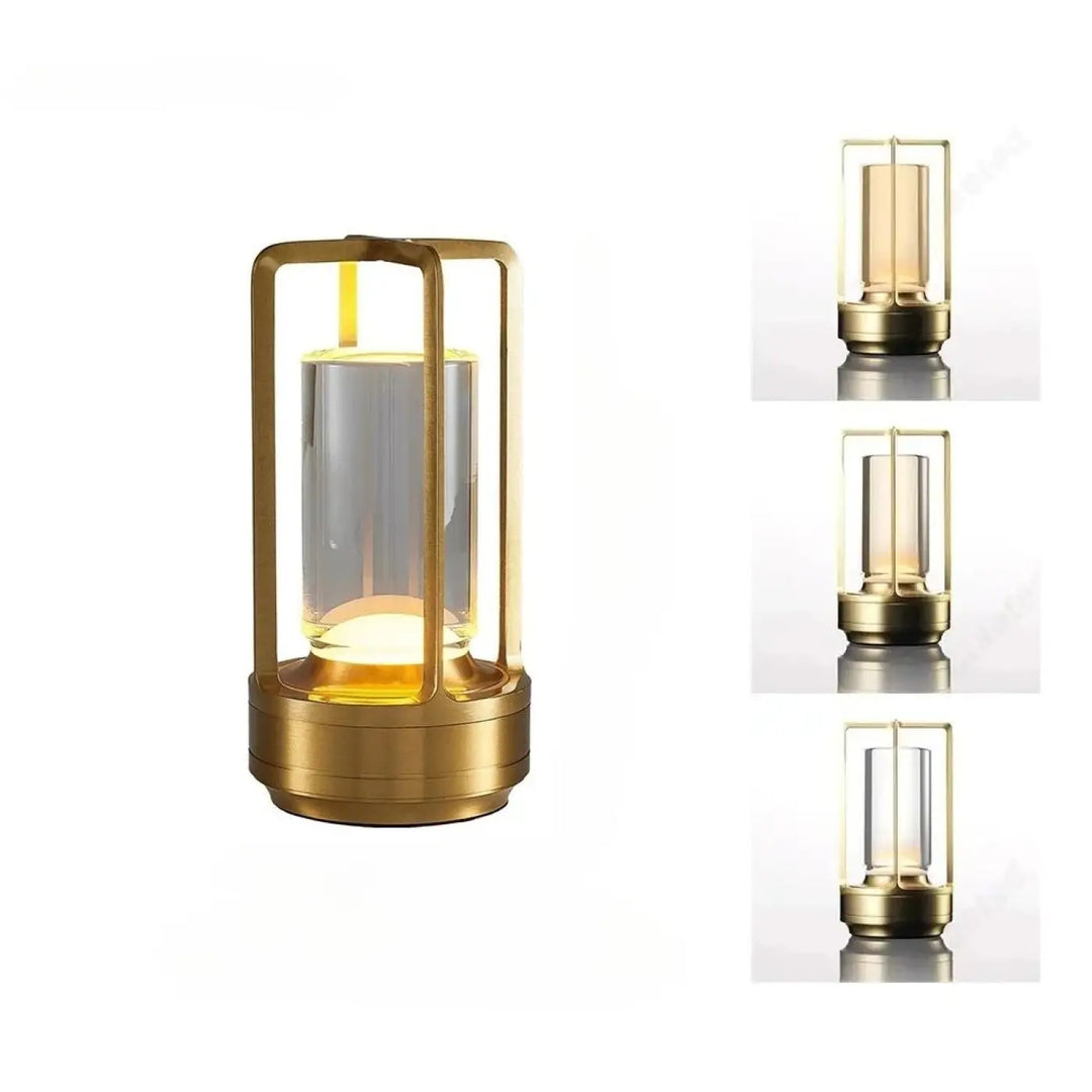 Lampe de table noctis en métal doré avec cylindre en verre clair abritant une source lumineuse led à commande tactile