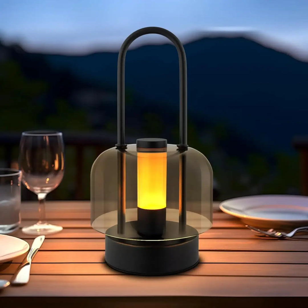 Lampe de table zora en métal noir avec lanterne à verre transparent et lumière ambre couleur gradation continue