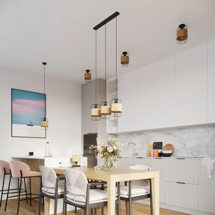 Lampe a poser série gizur style loft avec abat-jour tissé beige et cadre métallique noir au-dessus de la table à manger