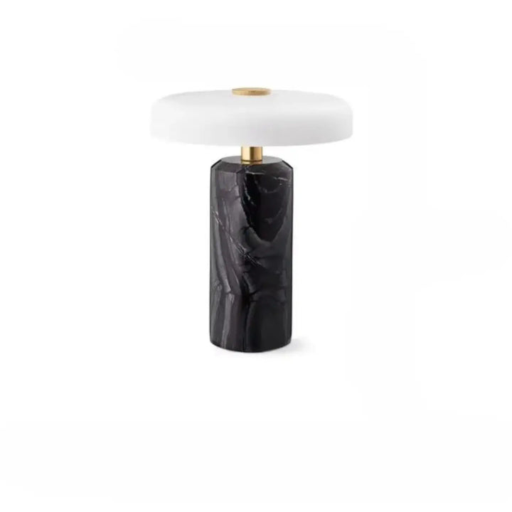 Lampe de table marbelia en marbre noir avec abat-jour blanc circulaire et accents dorés élégants