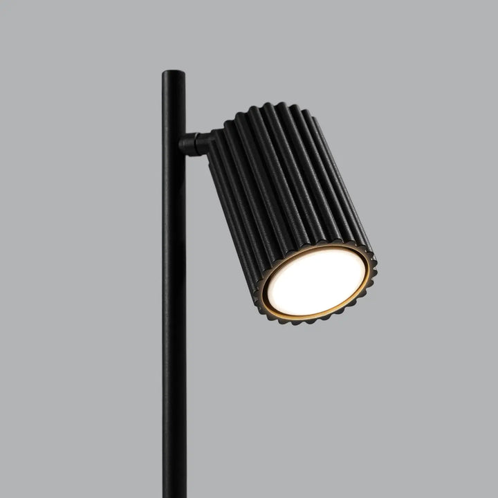 Lampe a poser karbon noir avec design minimaliste et ampoules gu10 interchangeables émettant une lumière chaude