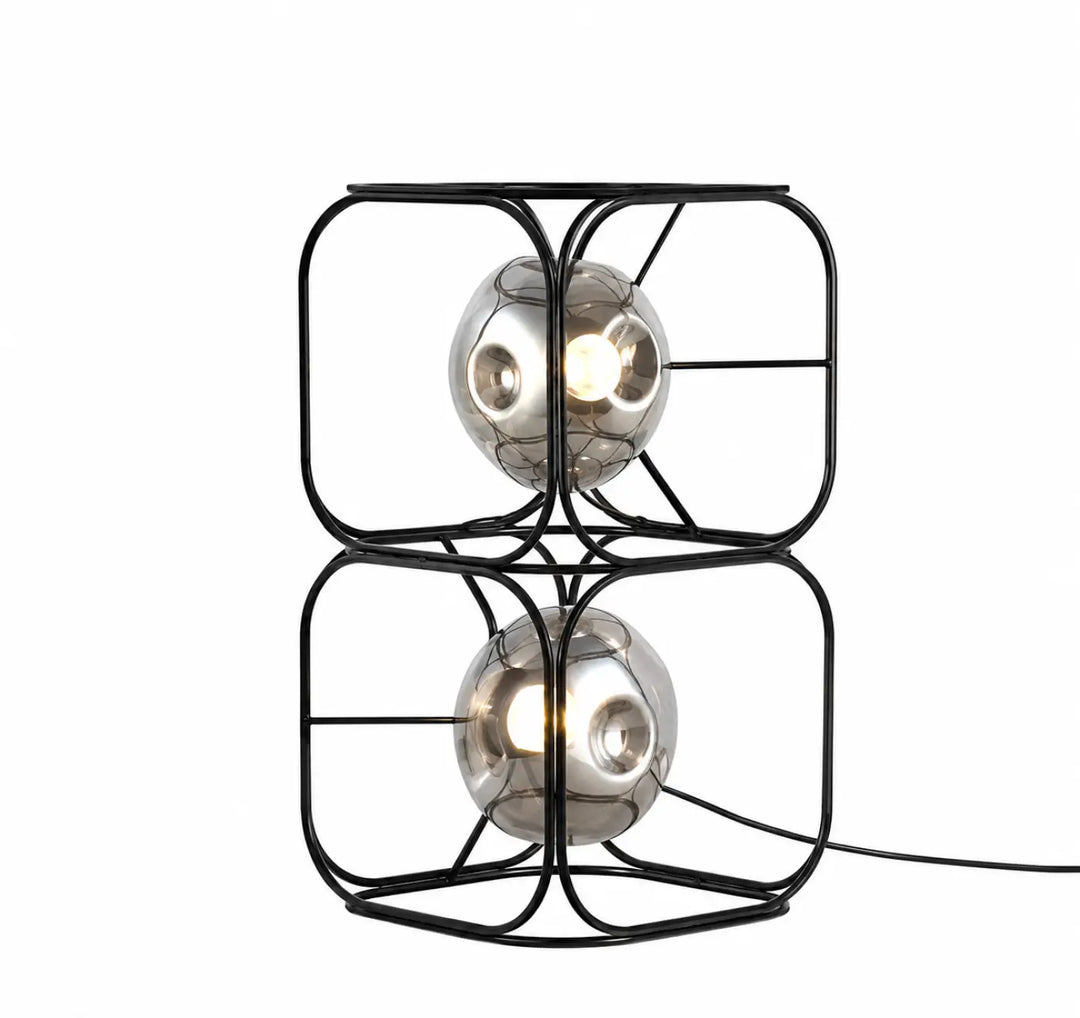 Lampe de table haloza avec cadre en métal noir et deux sphères lumineuses en verre miroir pour un table design sculptural